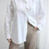 White shirt with details of festo